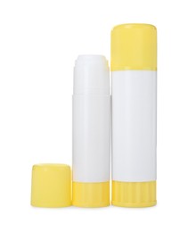 Photo of Two glue sticks with caps isolated on white