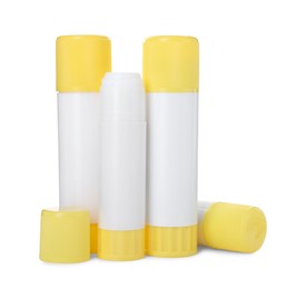 Photo of Many different glue sticks isolated on white