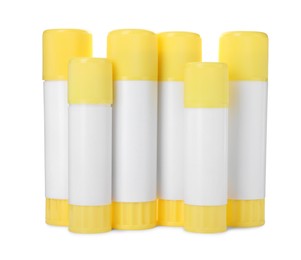 Photo of Many different glue sticks isolated on white