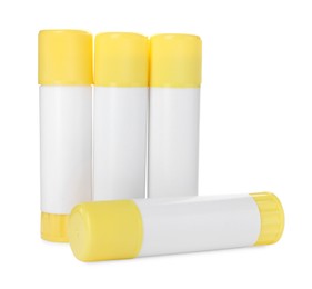 Photo of Many different glue sticks isolated on white