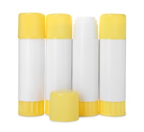 Photo of Many different glue sticks isolated on white