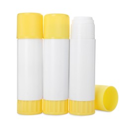 Photo of Many different glue sticks isolated on white