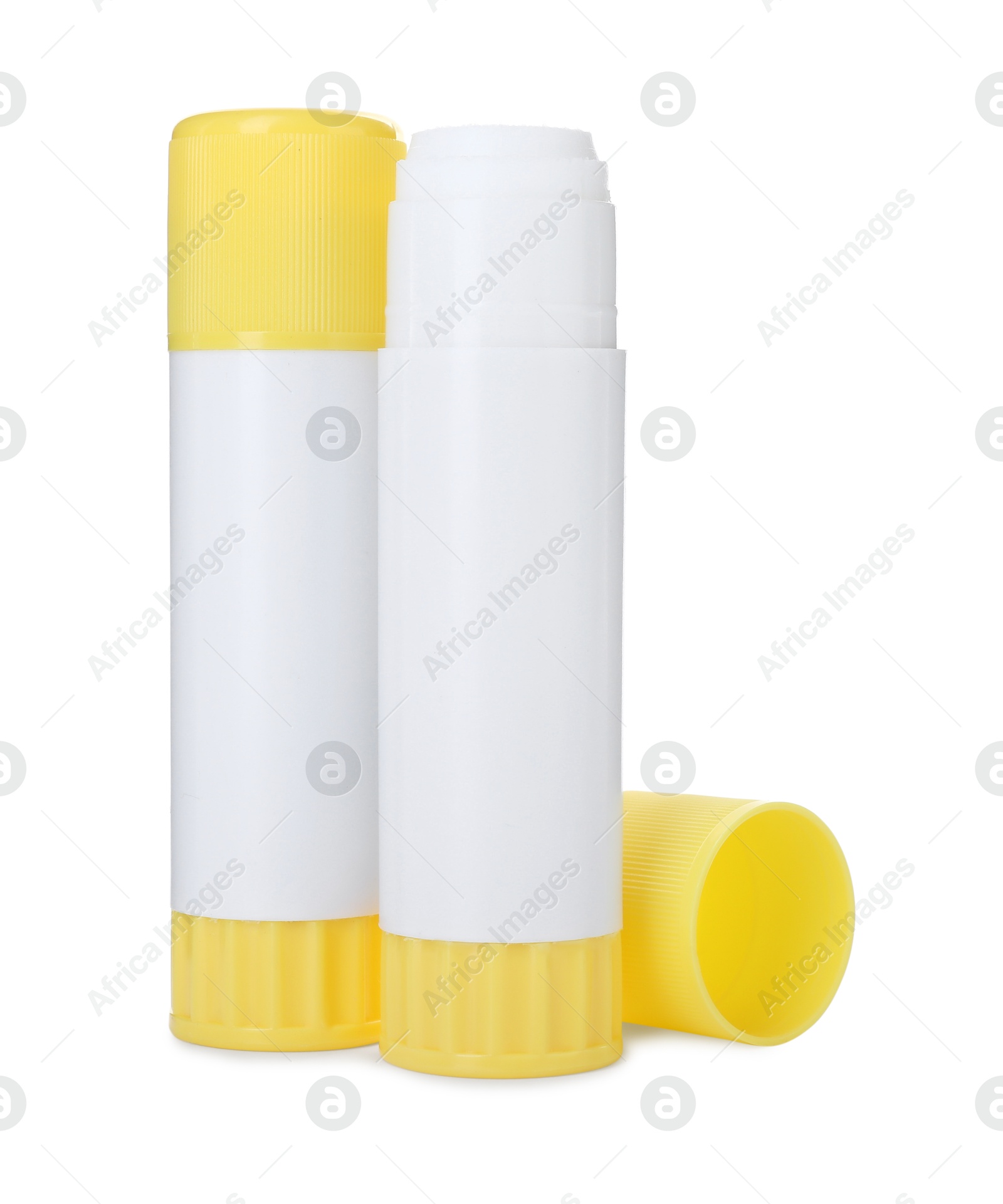 Photo of Two glue sticks with caps isolated on white