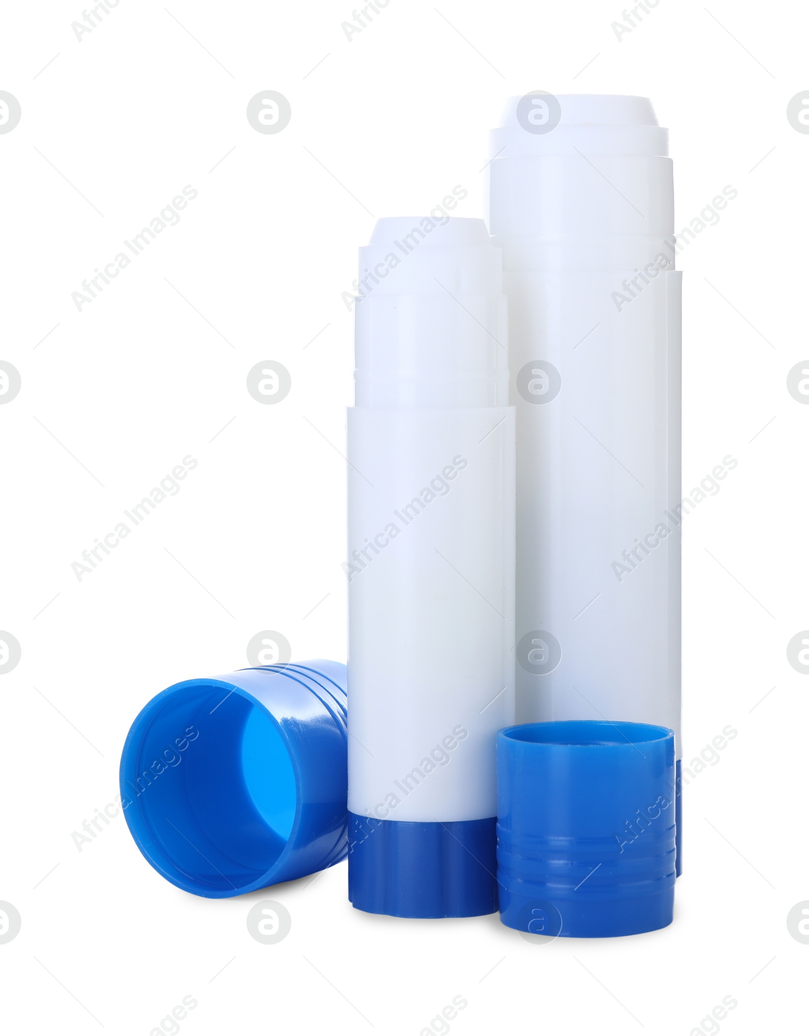 Photo of Two glue sticks with caps isolated on white