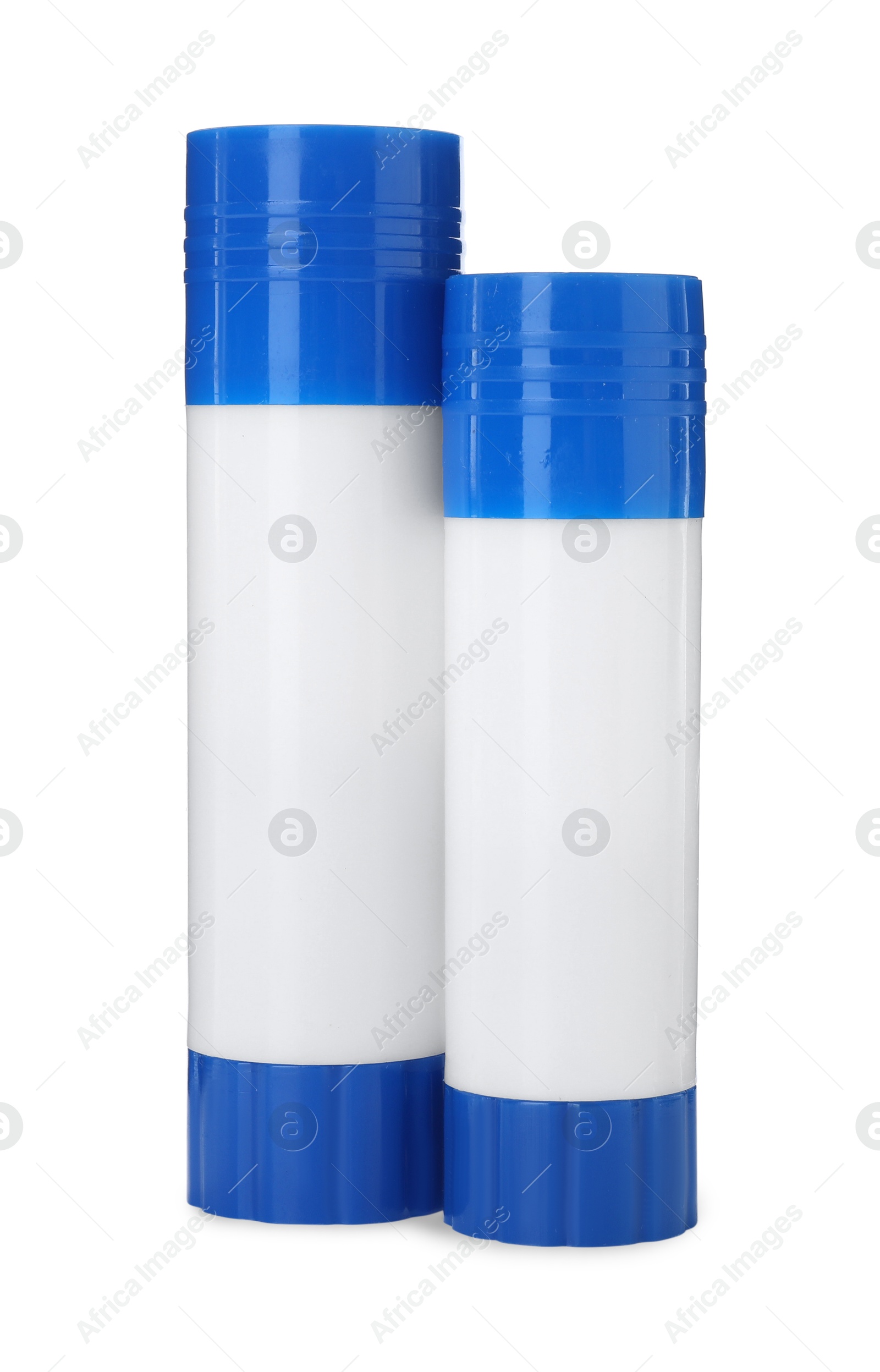 Photo of Two glue sticks with caps isolated on white