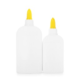 Photo of Bottles of glue with caps isolated on white