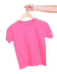 Photo of Woman holding hanger with pink t-shirt on white background, closeup