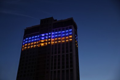 Photo of Exterior of modern building in evening, low angle view