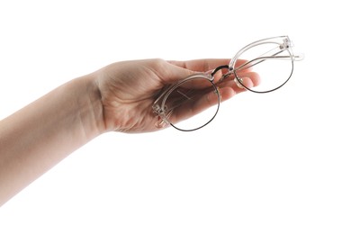 Photo of Woman holding glasses with stylish transparent frame on white background, closeup