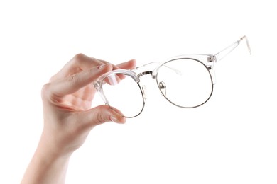 Photo of Woman holding glasses with stylish transparent frame on white background, closeup