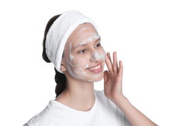 Photo of Teenage girl with cleansing foam on her face against white background. Acne treatment