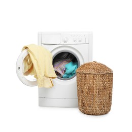 Photo of Modern washing machine and laundry basket isolated on white