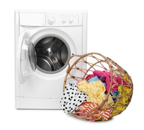 Photo of Washing machine and laundry basket with colorful clothes isolated on white