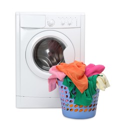 Photo of Washing machine and laundry basket with colorful clothes isolated on white