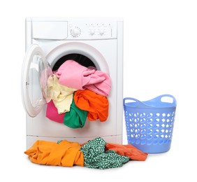 Photo of Washing machine with colorful clothes and basket isolated on white