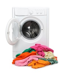 Photo of Washing machine and pile of colorful clothes isolated on white