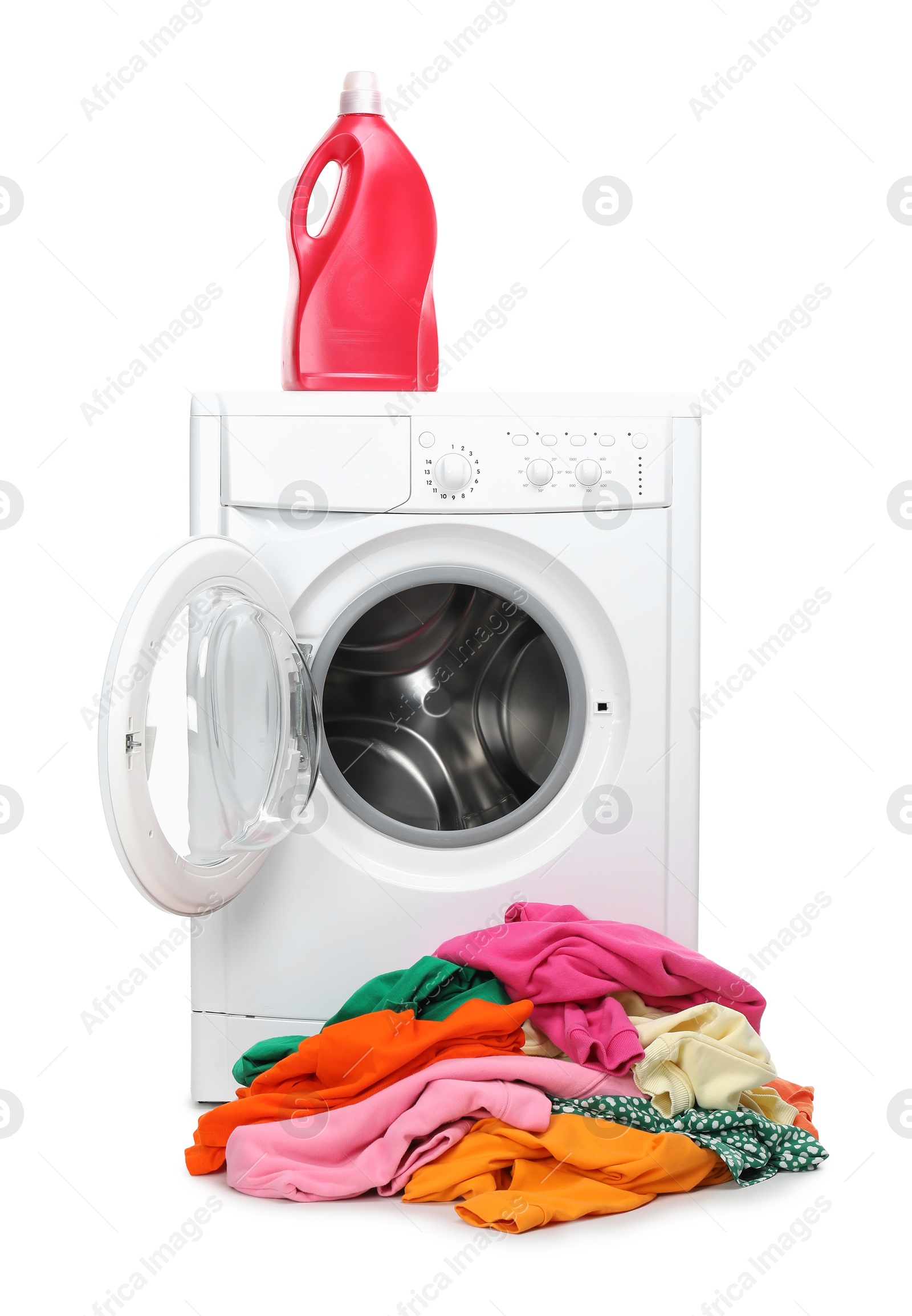 Photo of Washing machine, detergent and pile of colorful clothes isolated on white