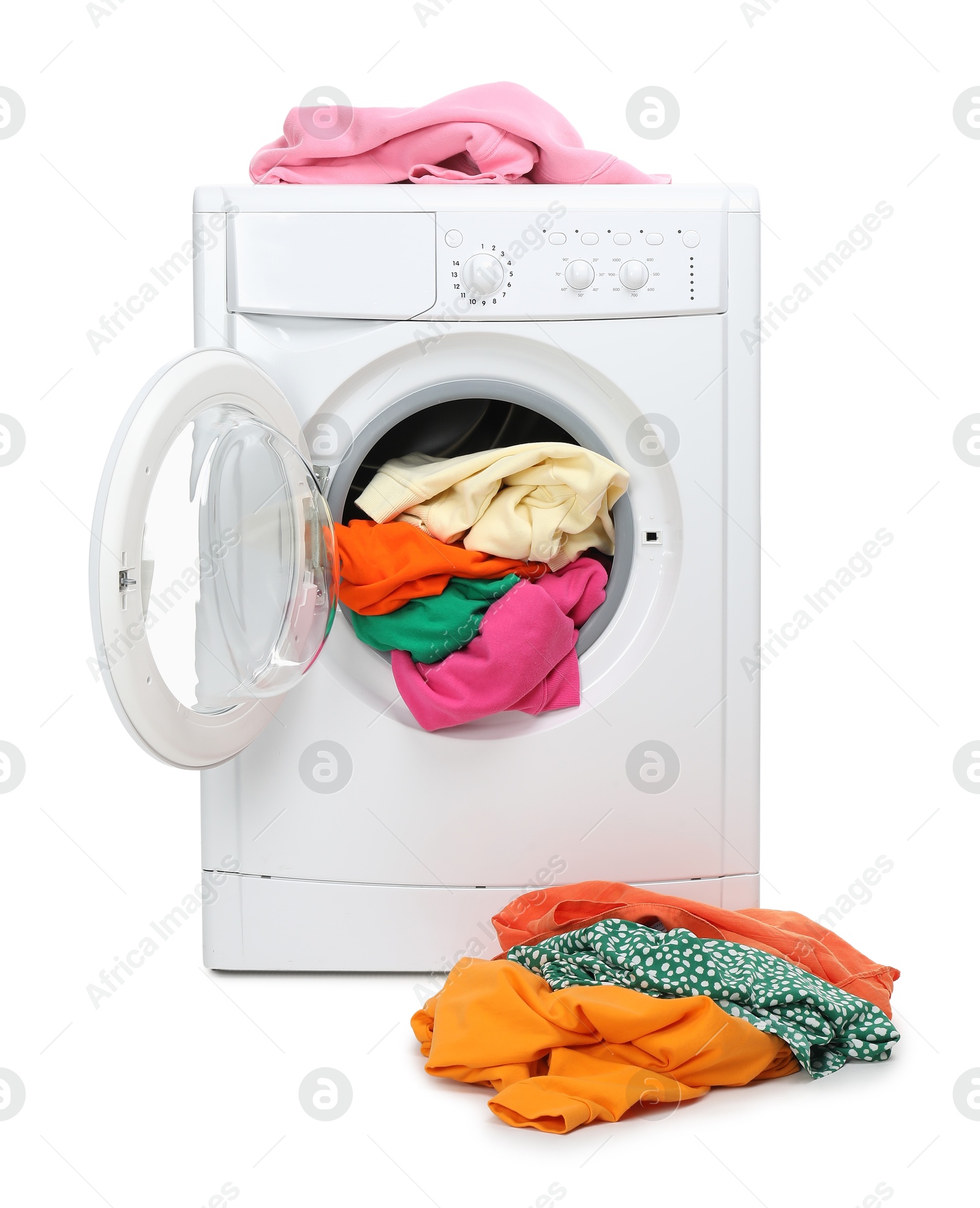 Photo of Washing machine full of colorful clothes isolated on white