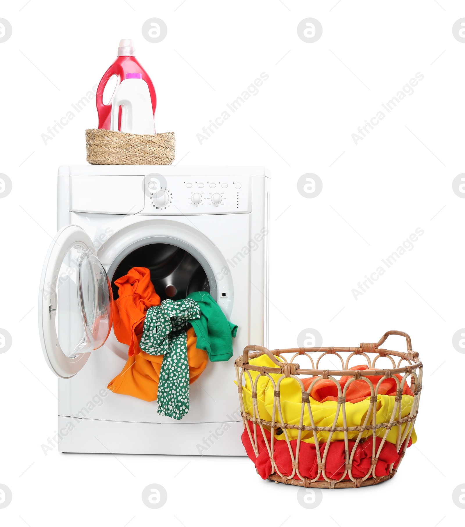 Photo of Washing machine, detergents and laundry basket with colorful clothes isolated on white