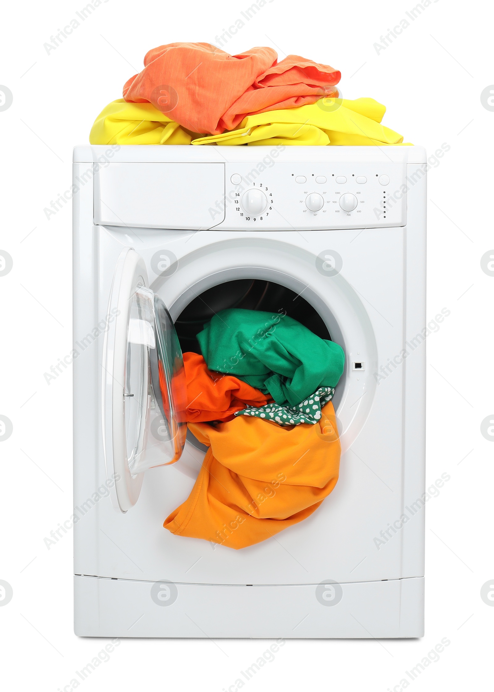 Photo of Washing machine full of colorful clothes isolated on white