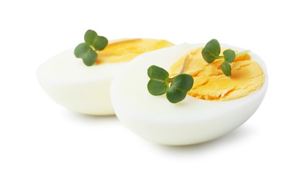 Photo of Halves of hard boiled egg isolated on white