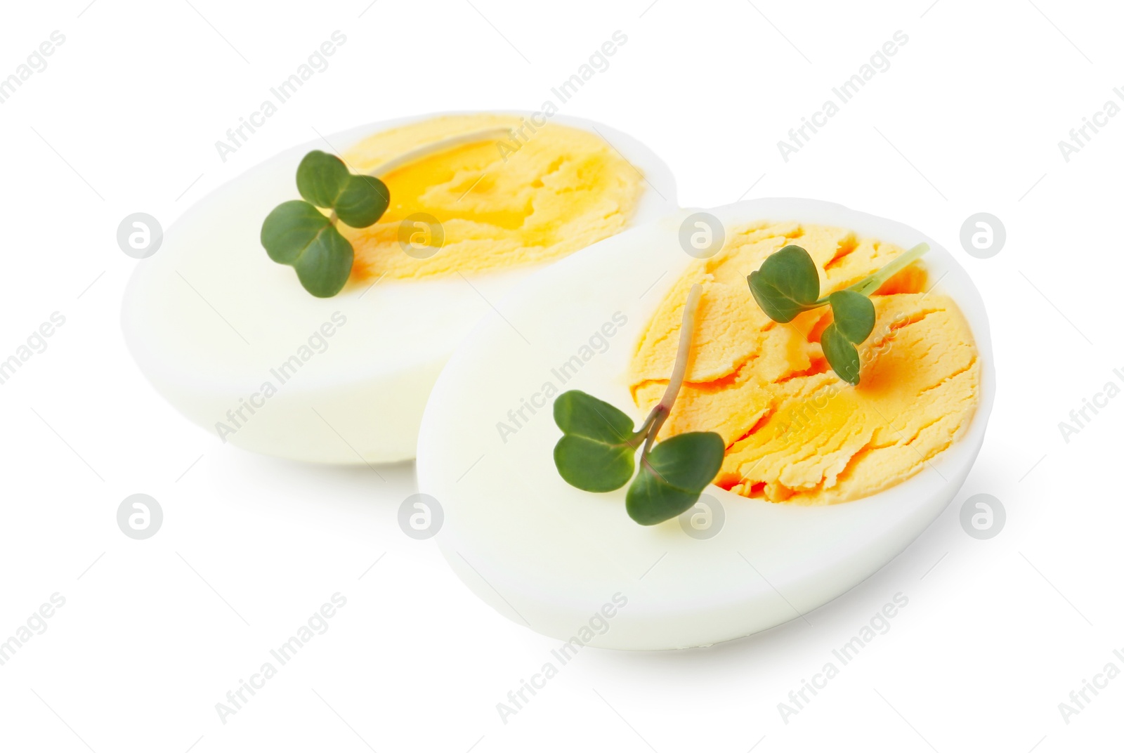 Photo of Halves of hard boiled egg isolated on white