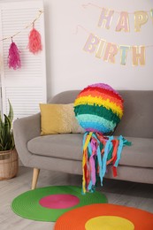 Photo of Colorful pinata and party accessories in festive decorated room