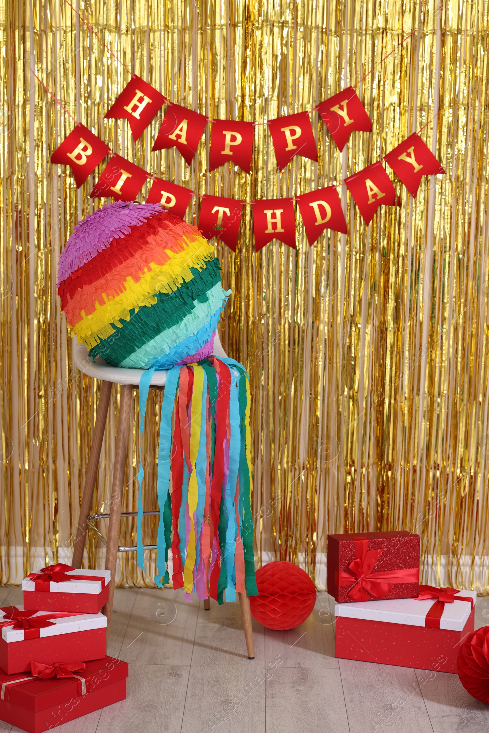 Photo of Colorful pinata and party accessories in festive decorated room