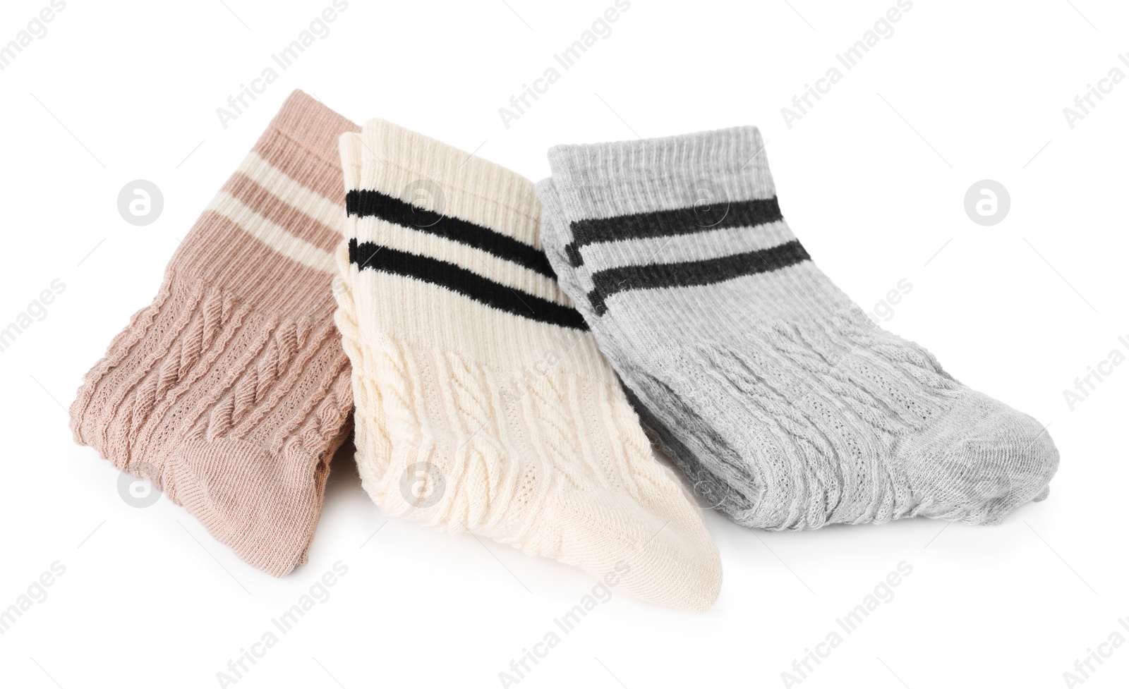 Photo of Many folded soft socks isolated on white