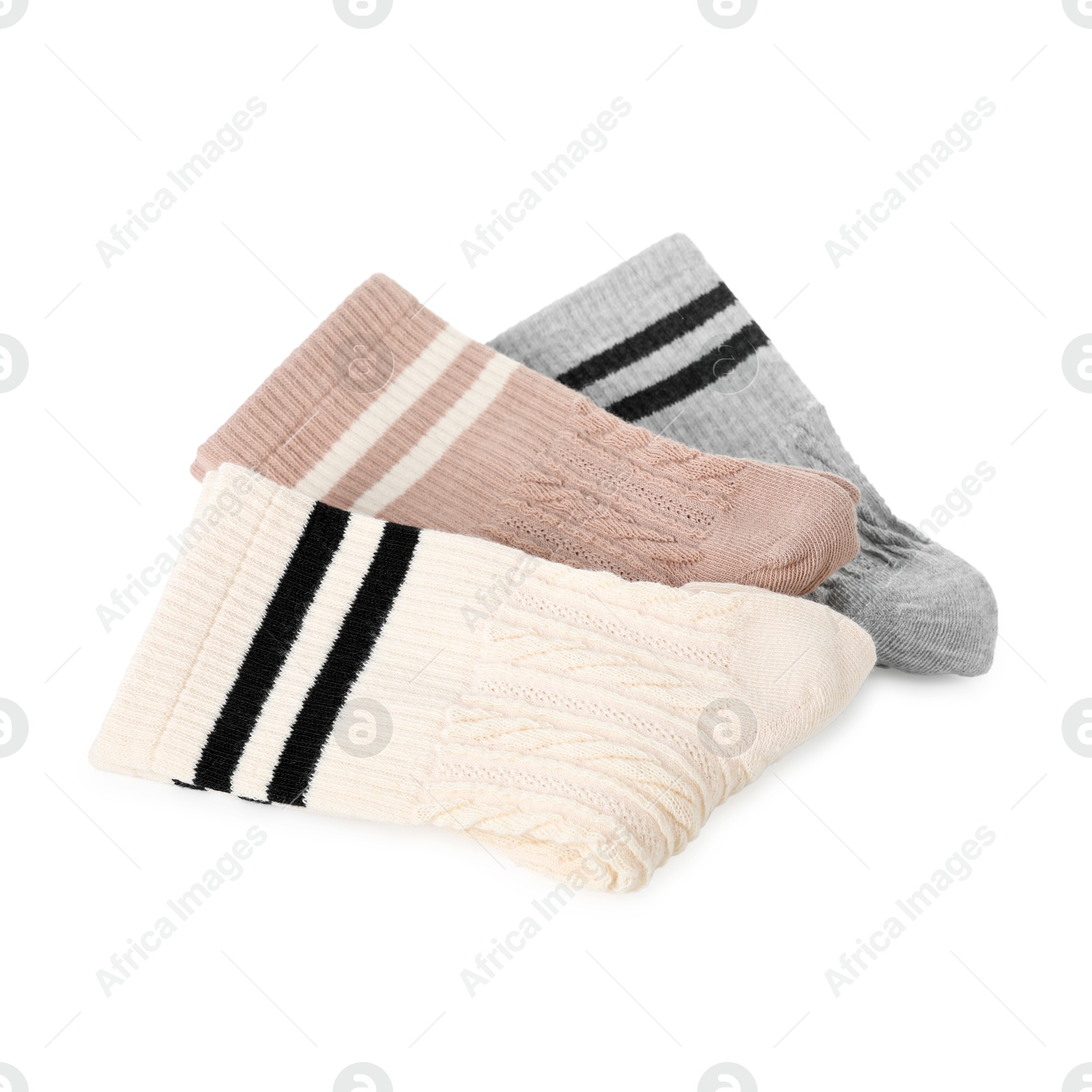 Photo of Pairs of folded soft socks isolated on white