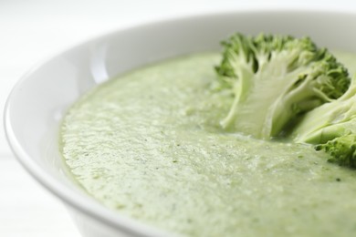 Photo of Delicious broccoli cream soup in bowl, closeup