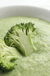 Photo of Delicious broccoli cream soup in bowl, closeup