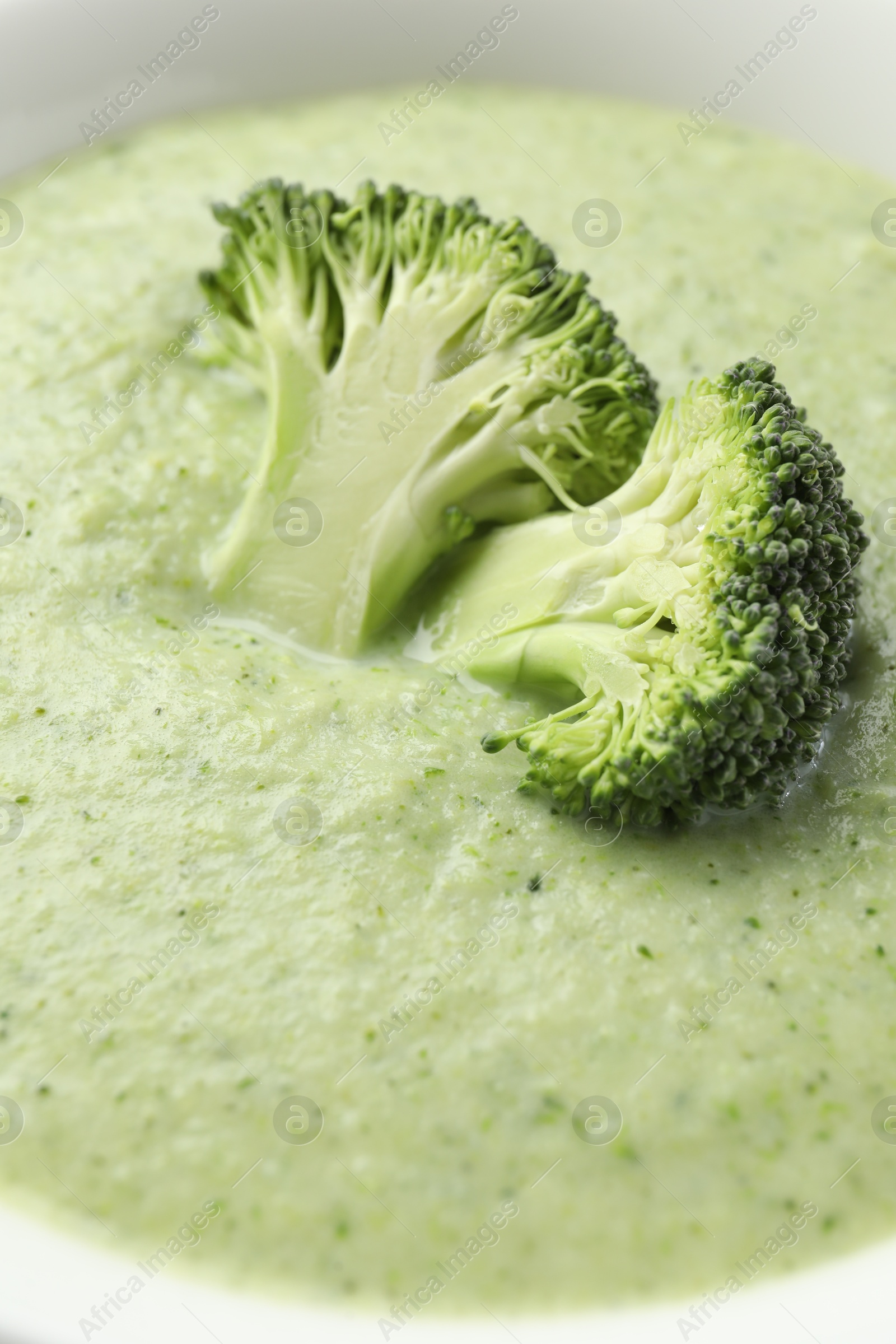 Photo of Delicious broccoli cream soup in bowl, closeup