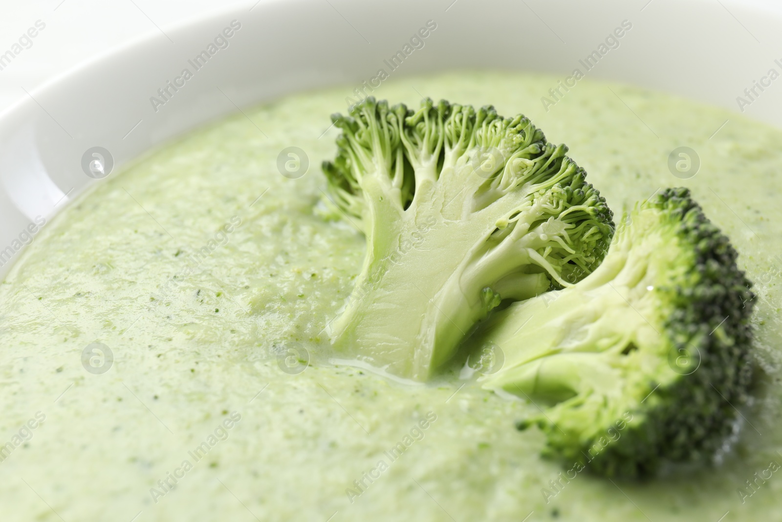 Photo of Delicious broccoli cream soup in bowl, closeup