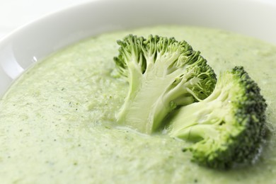 Delicious broccoli cream soup in bowl, closeup