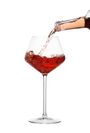 Photo of Pouring wine into glass on white background