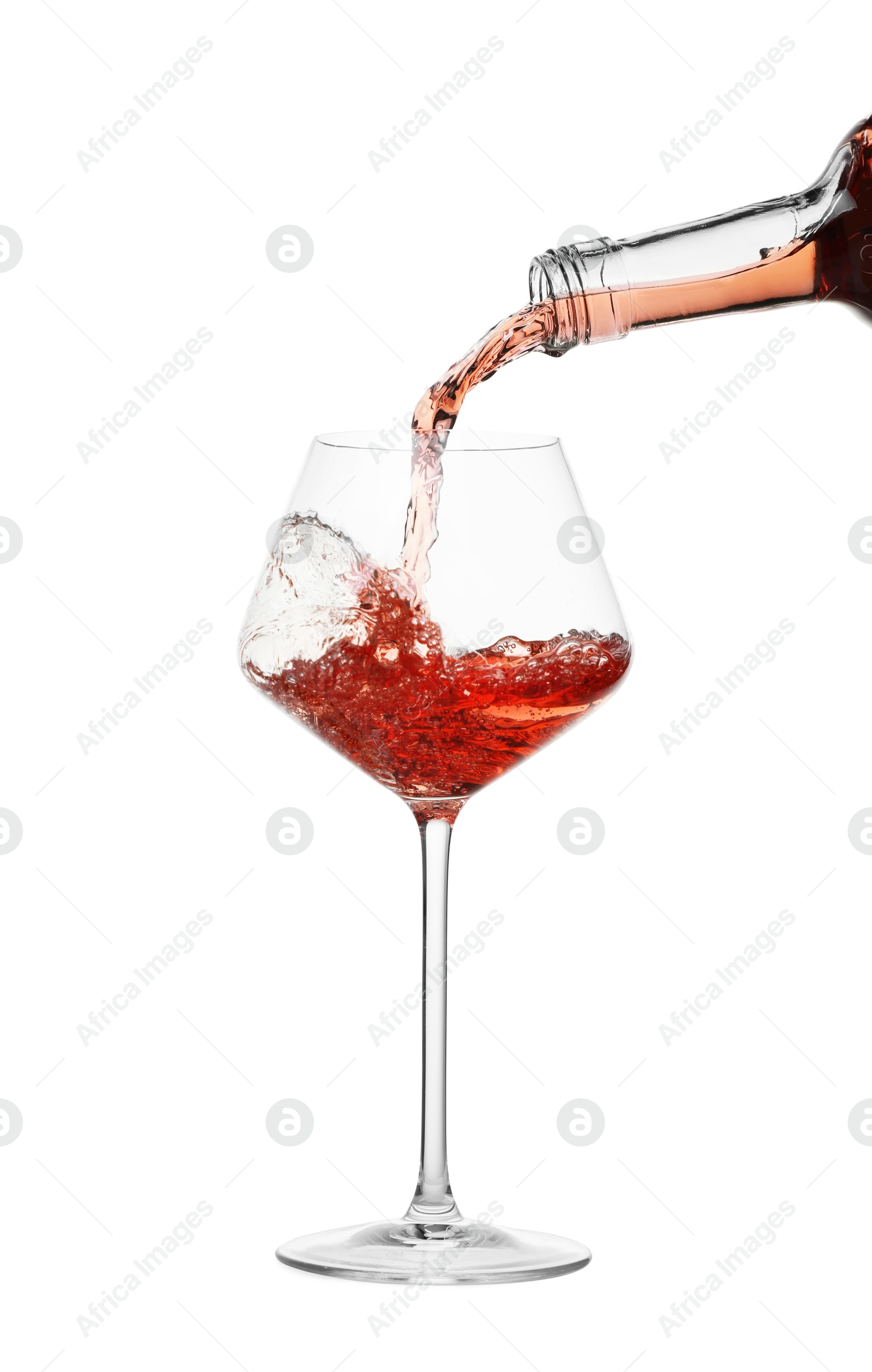 Photo of Pouring wine into glass on white background