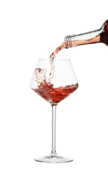 Photo of Pouring wine into glass on white background