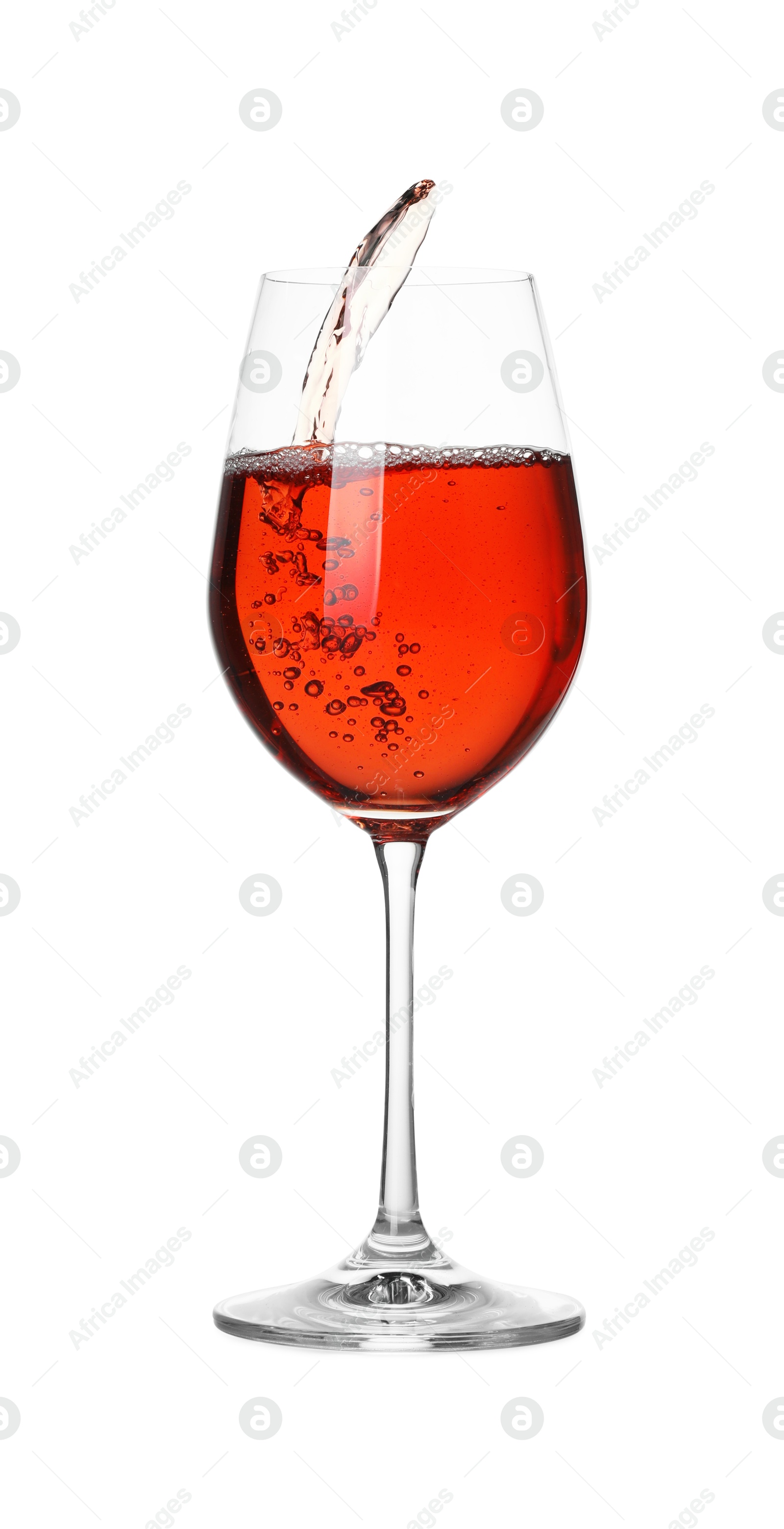 Photo of Tasty wine splashing in glass on white background