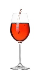 Photo of Tasty wine splashing in glass on white background