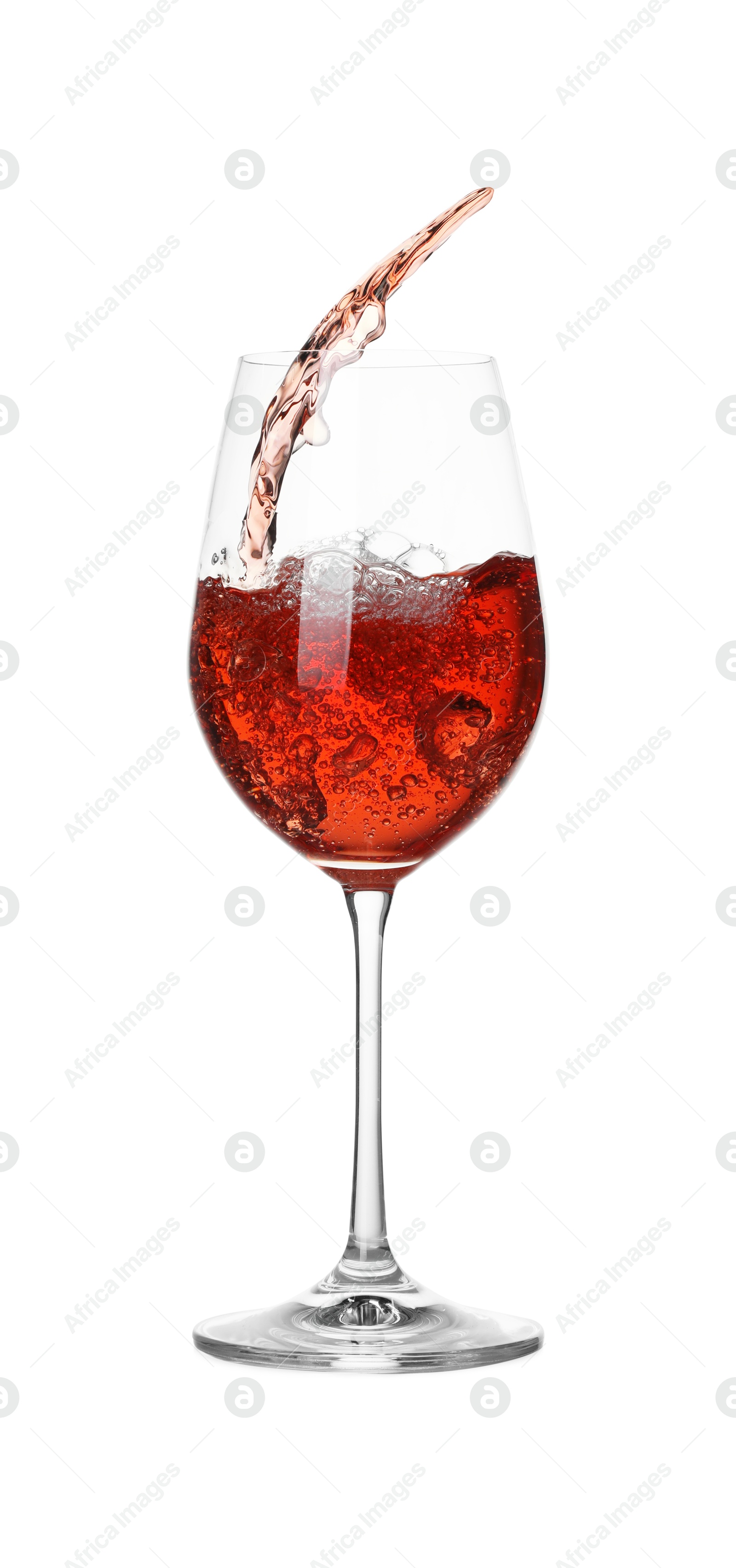 Photo of Tasty wine splashing in glass on white background