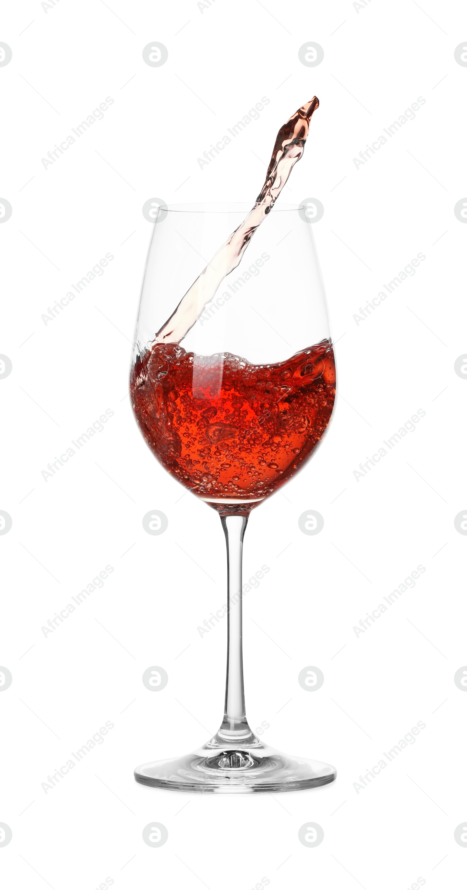 Photo of Tasty wine splashing in glass on white background