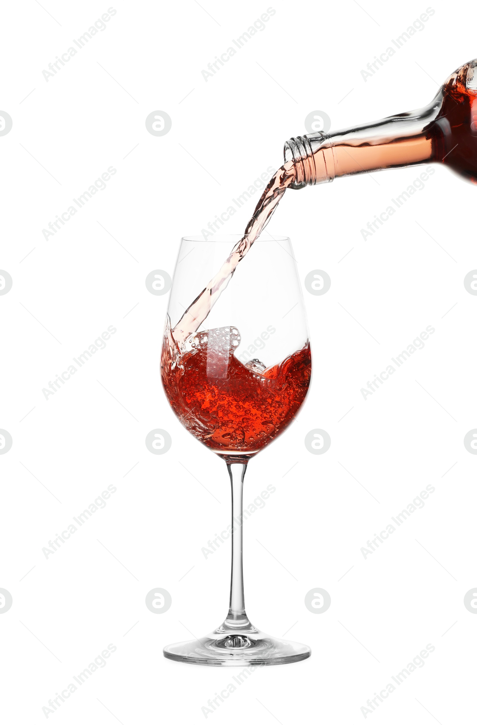 Photo of Pouring wine into glass on white background