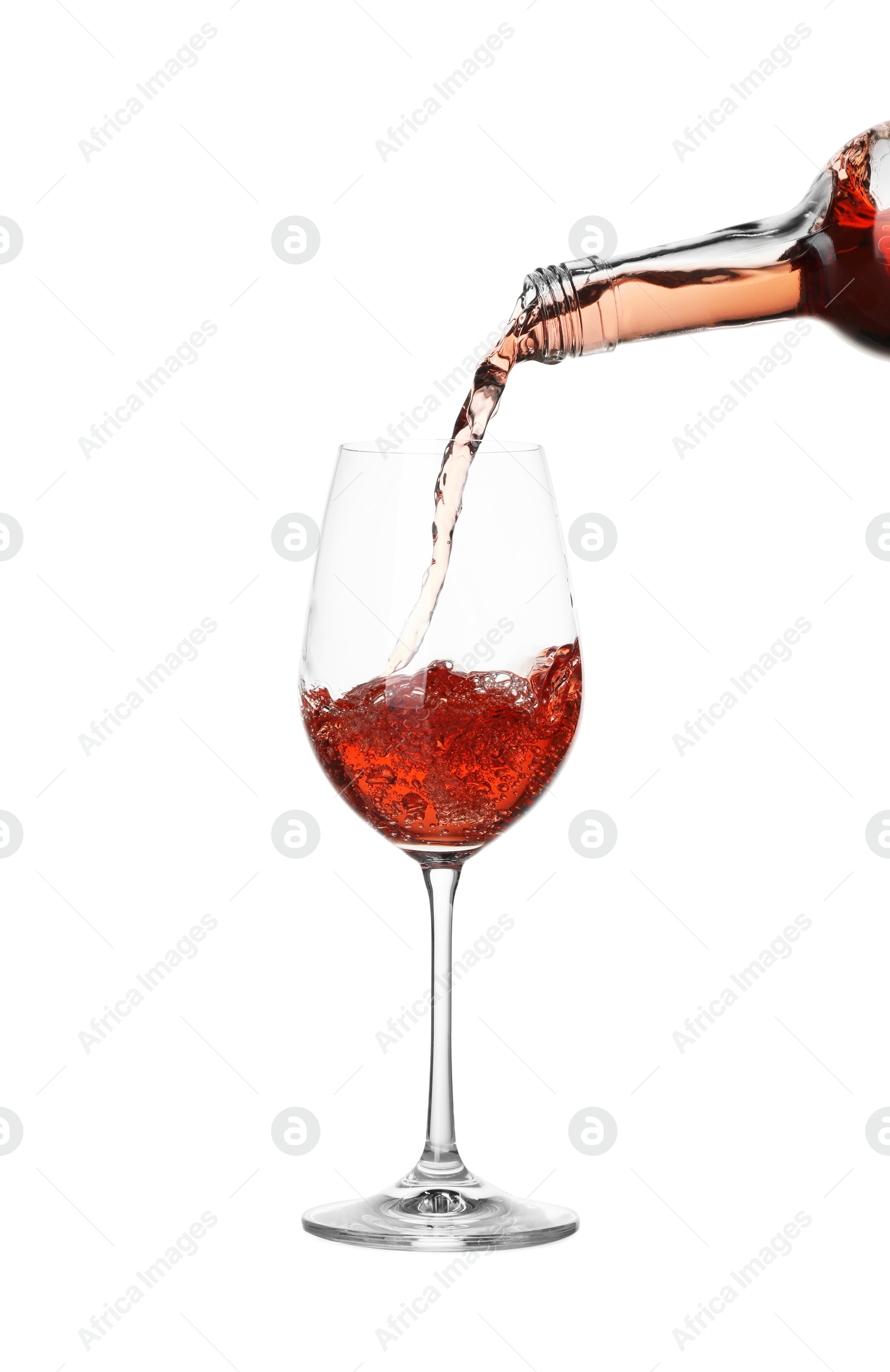 Photo of Pouring wine into glass on white background