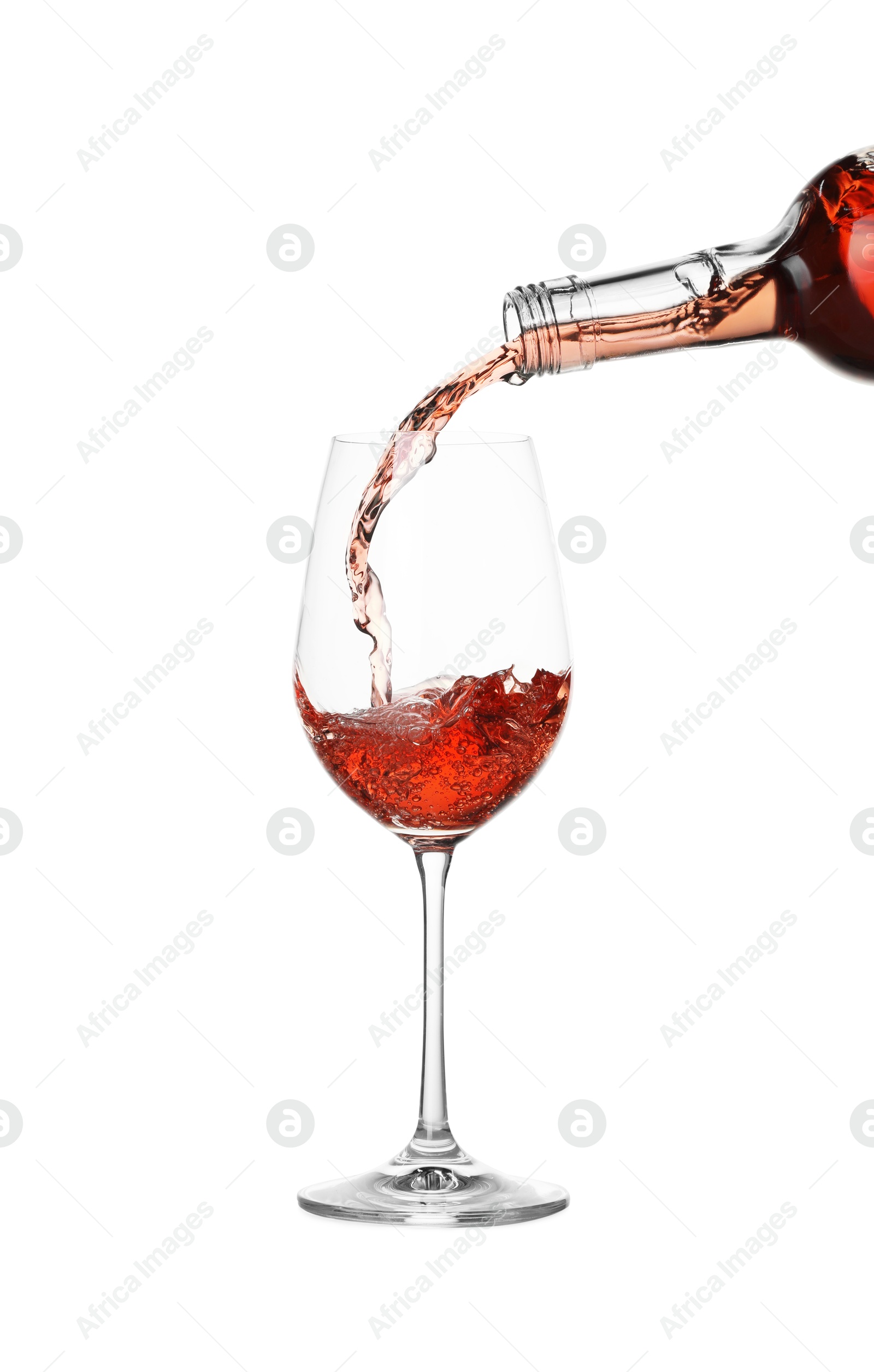 Photo of Pouring wine into glass on white background