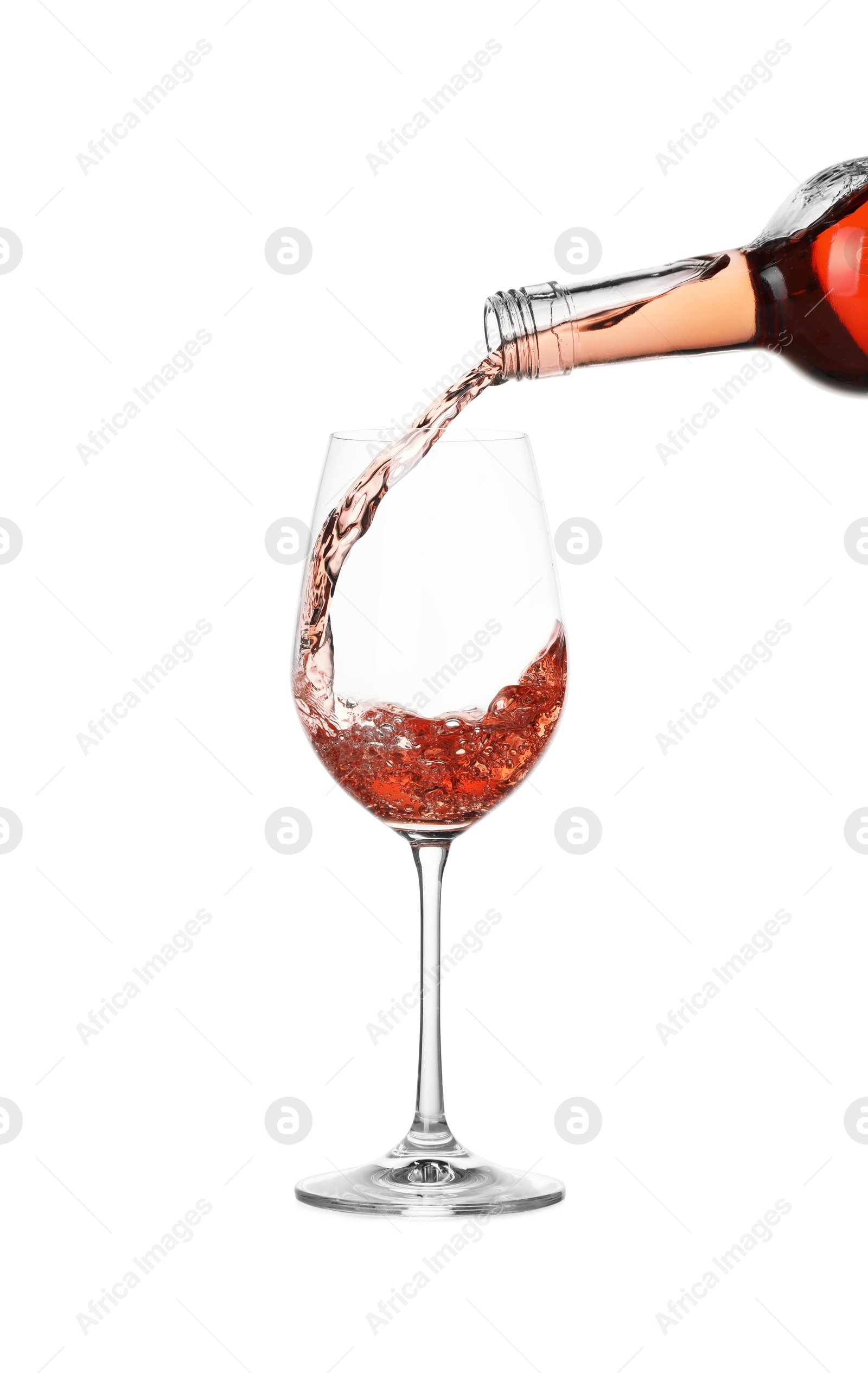 Photo of Pouring wine into glass on white background