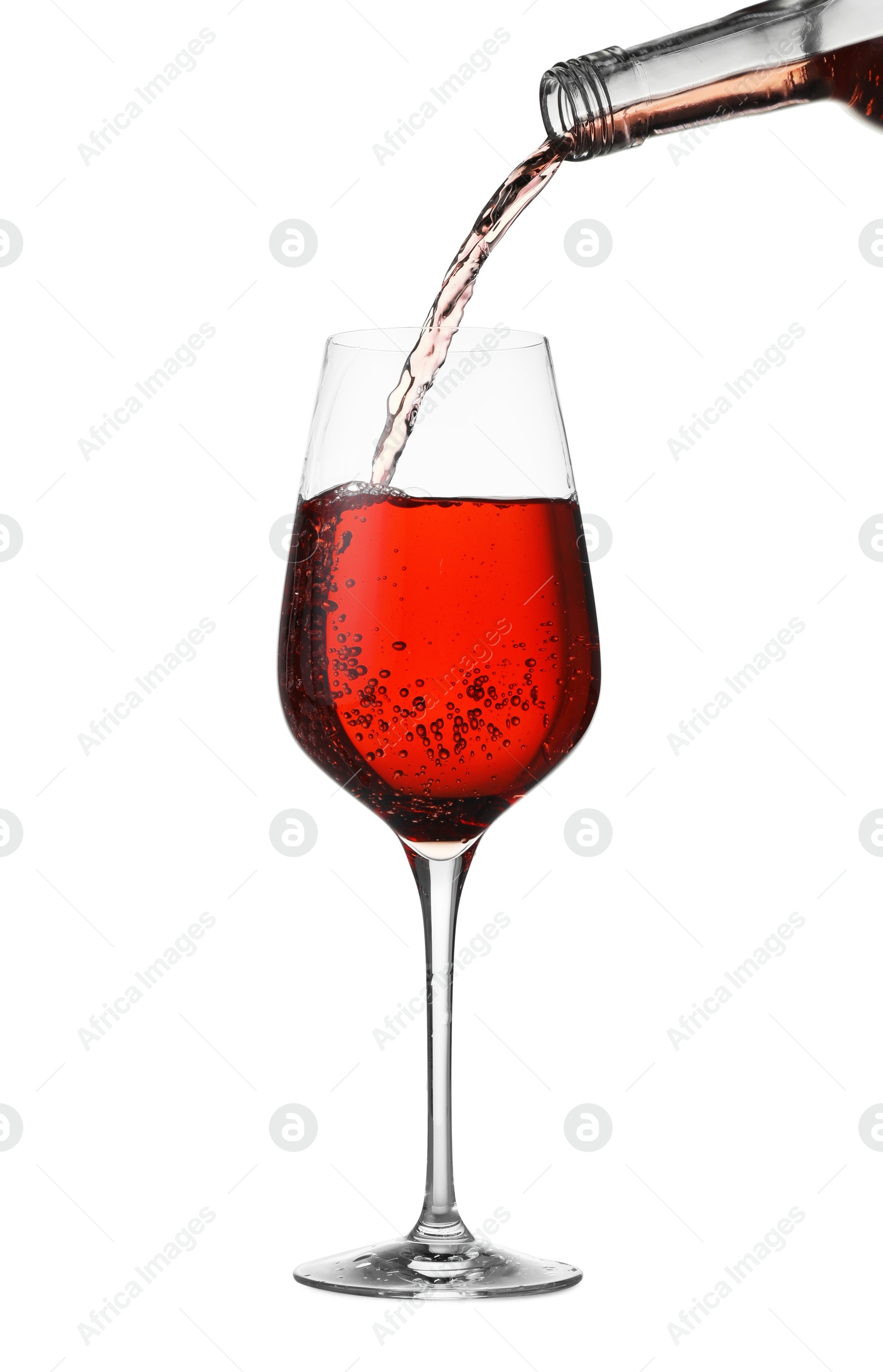 Photo of Pouring wine into glass on white background