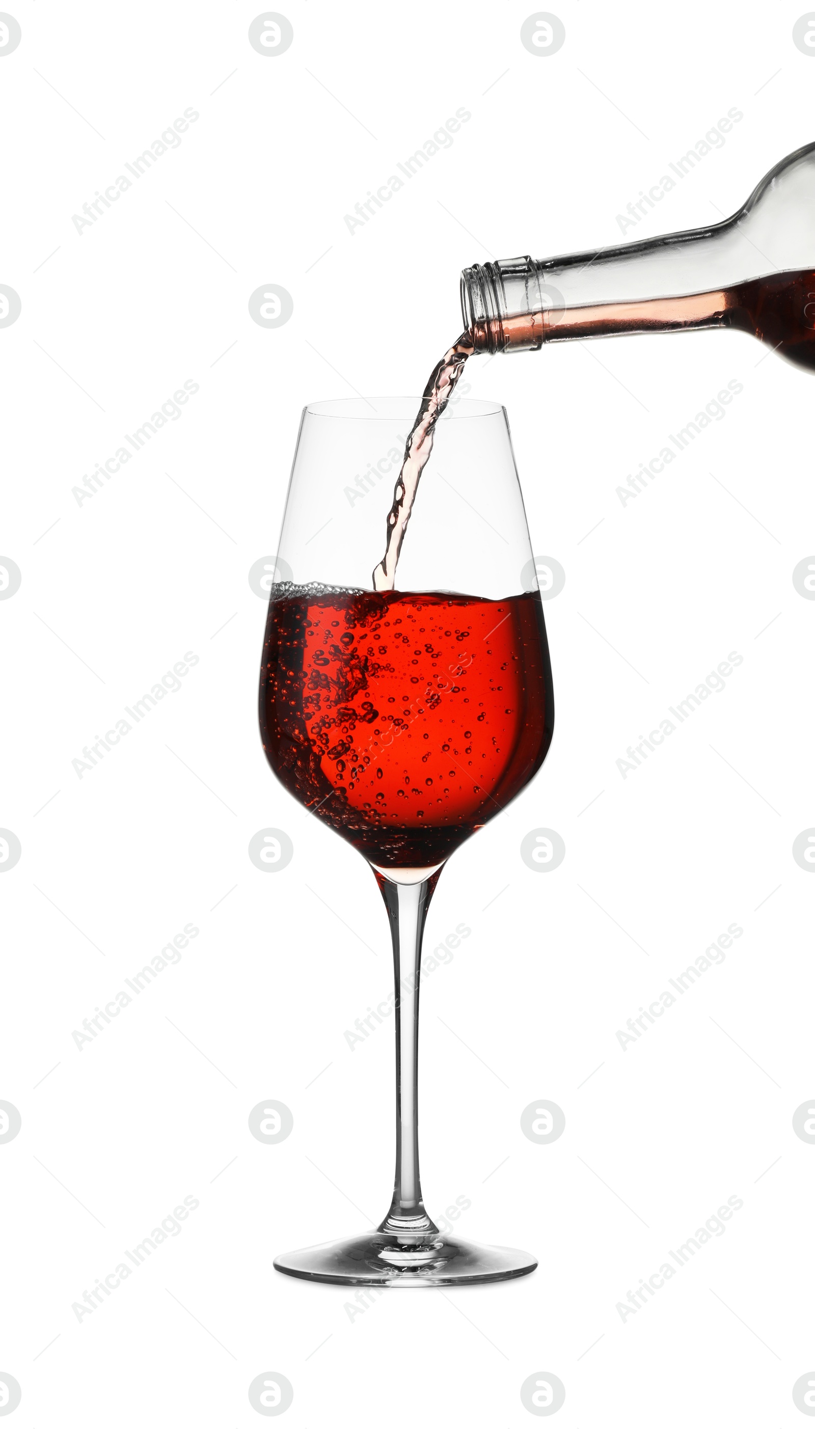 Photo of Pouring wine into glass on white background