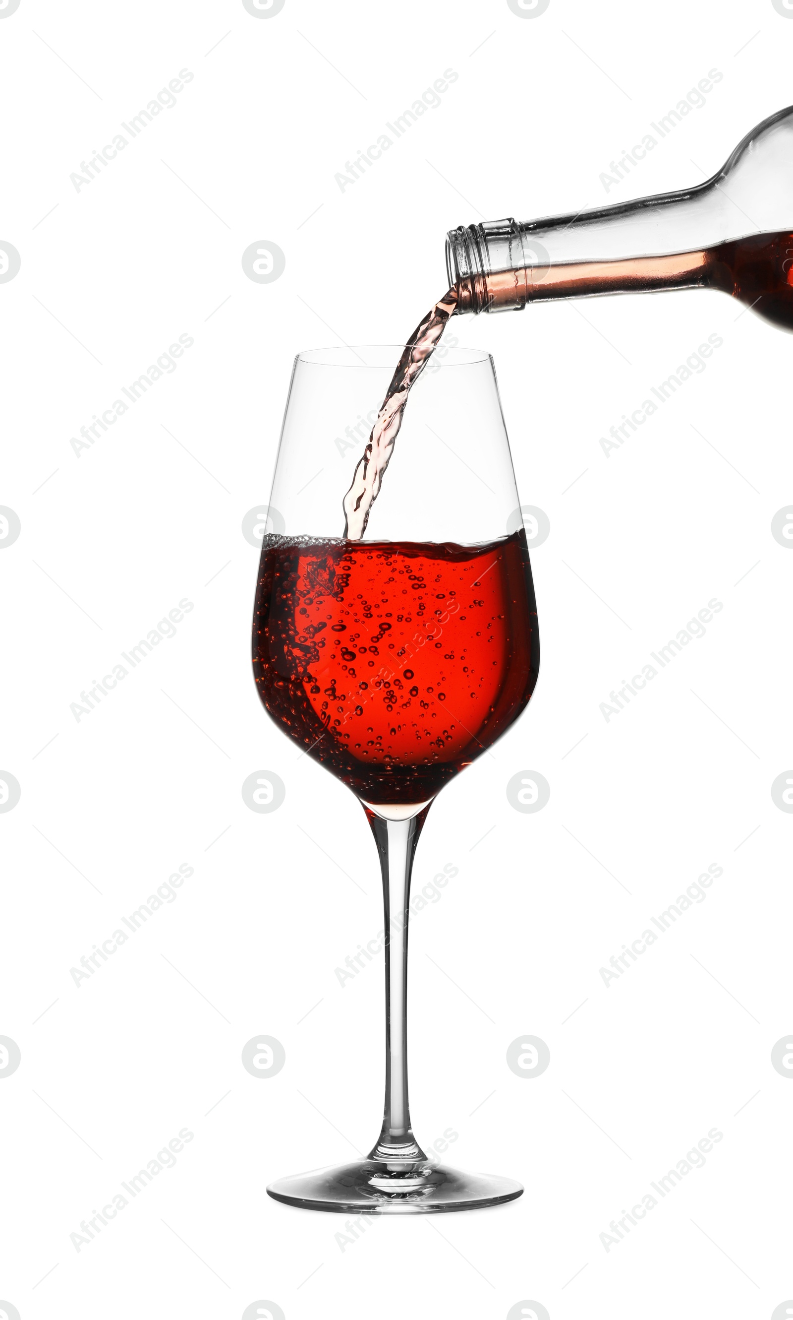 Photo of Pouring wine into glass on white background