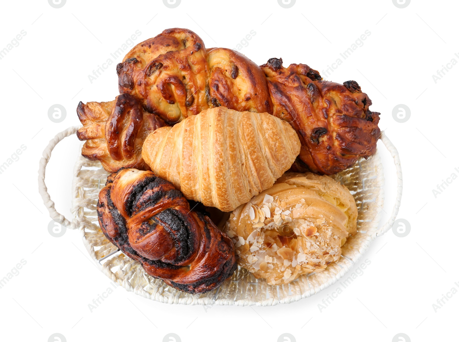 Photo of Different delicious pastries in basket isolated on white, top view